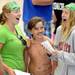 Forestbrooke coaches Elinor Chambers, left, and Jackie Swartz react as they see swimmer Thor Clarke, 11, and his marker mustache during the Washtenaw Interclub Swim Conference championships at Skyline High School on Thursday, July 25, 2013. Melanie Maxwell | AnnArbor.com